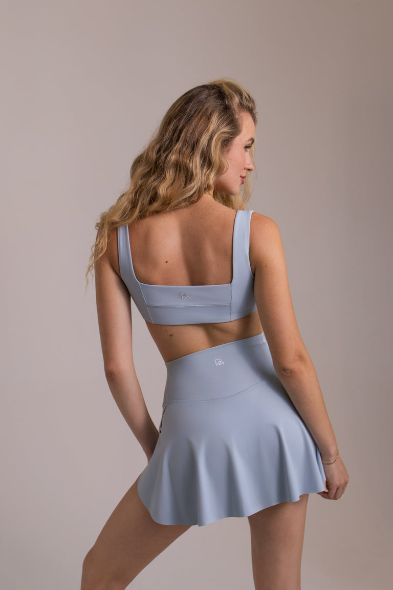 woman in light blue matching workout set ..