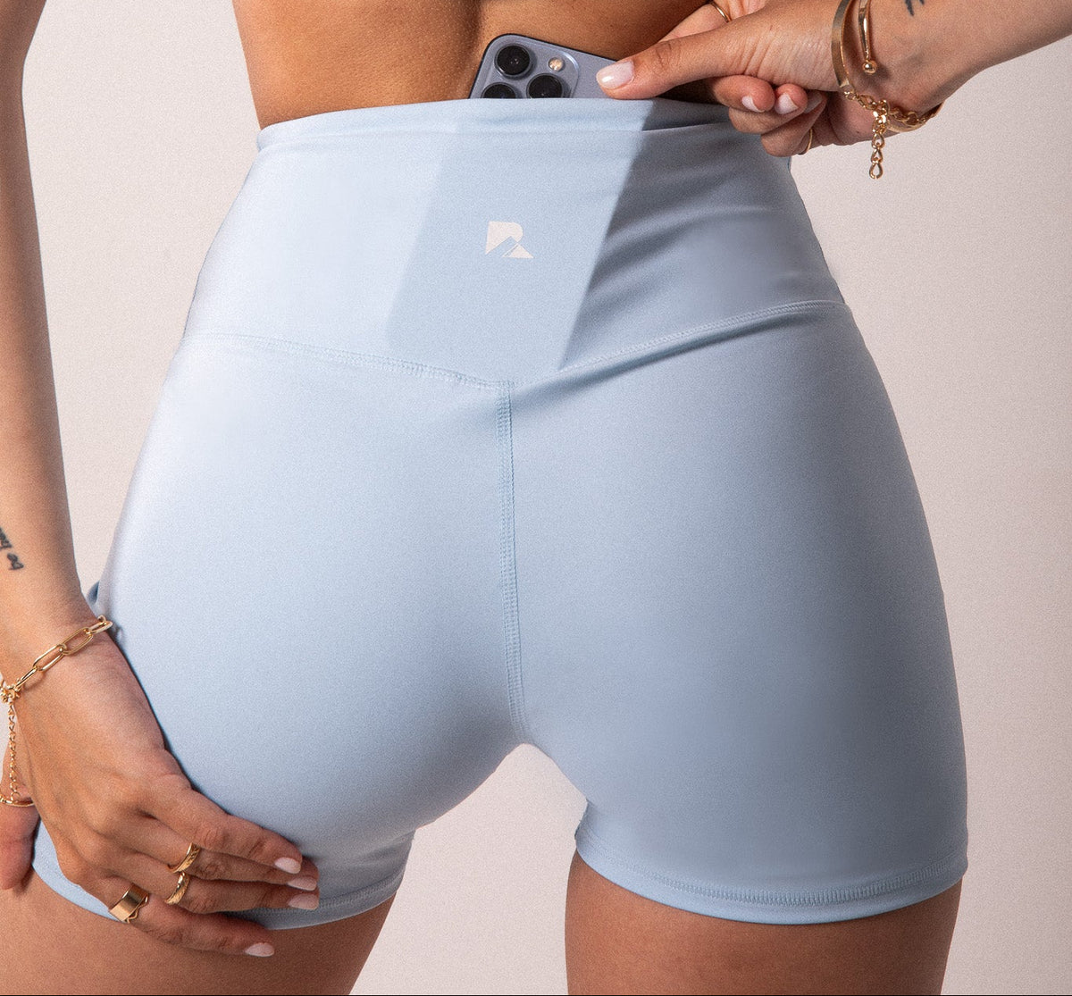 Light blue LuxeForm 5-inch sculpting shorts with phone pocket