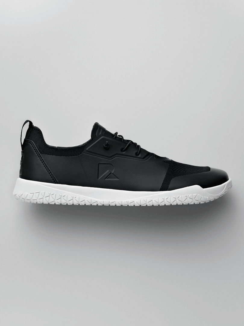 Black hybrid barefoot trainer with white sole, premium athletic design from Runner's Athletics.