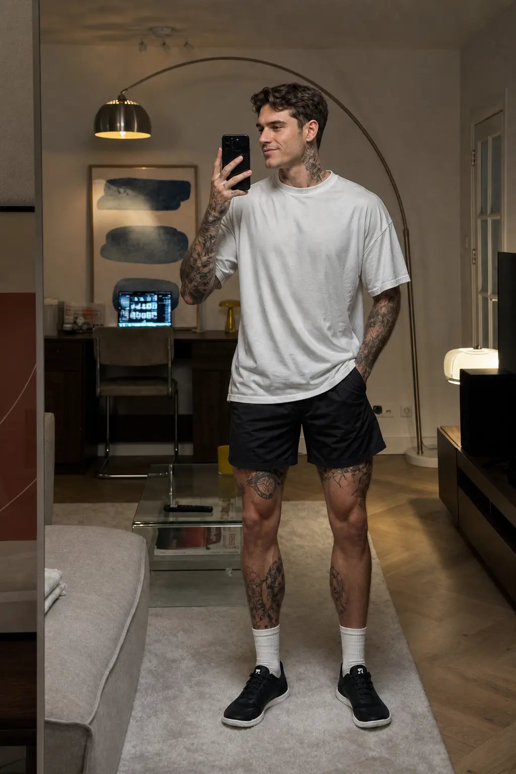 Black mens minimalist barefoot trainer on model casual mirror selfie at home