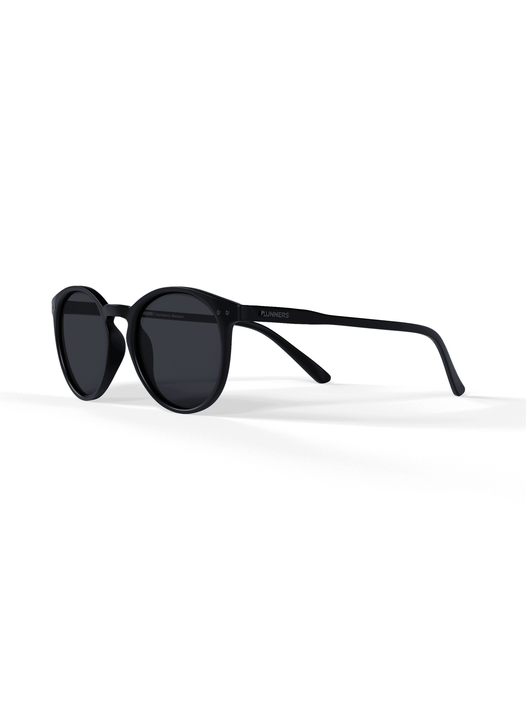 Black sunglasses on a green background