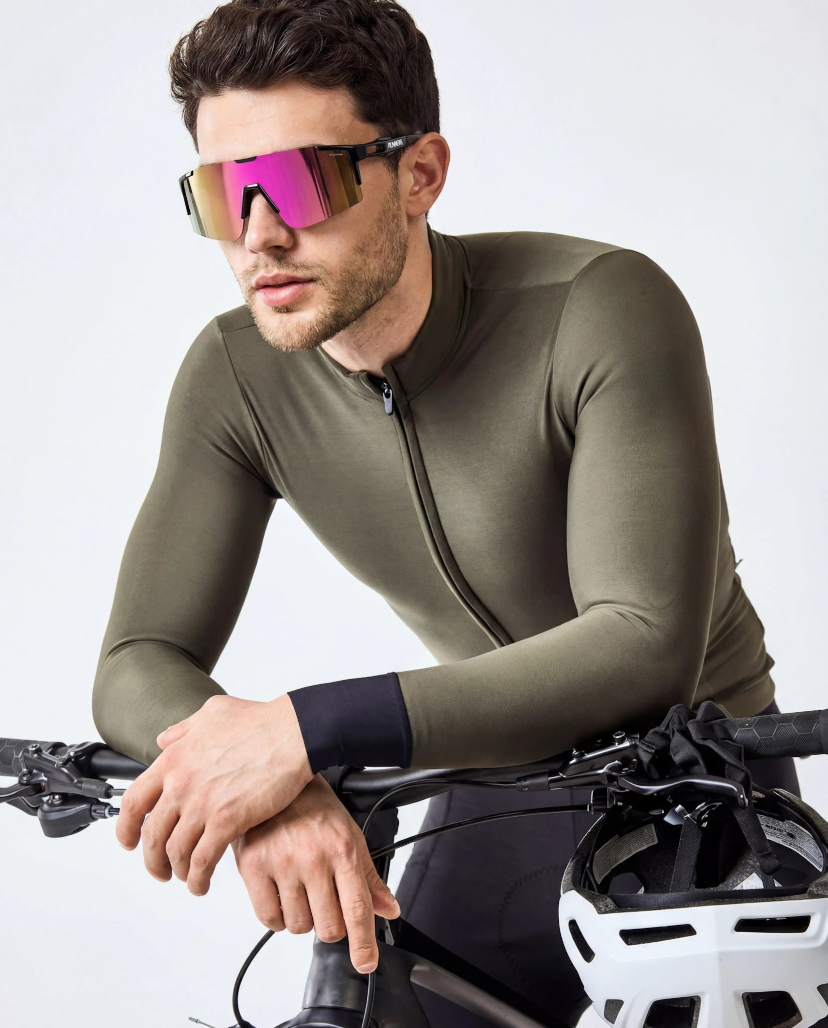 Man on bike wearing cherry pink polarized running sunglasses 