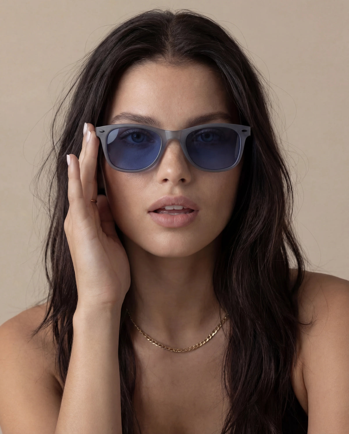 Women's running sunglasses with grey frame and blue tinted lenses