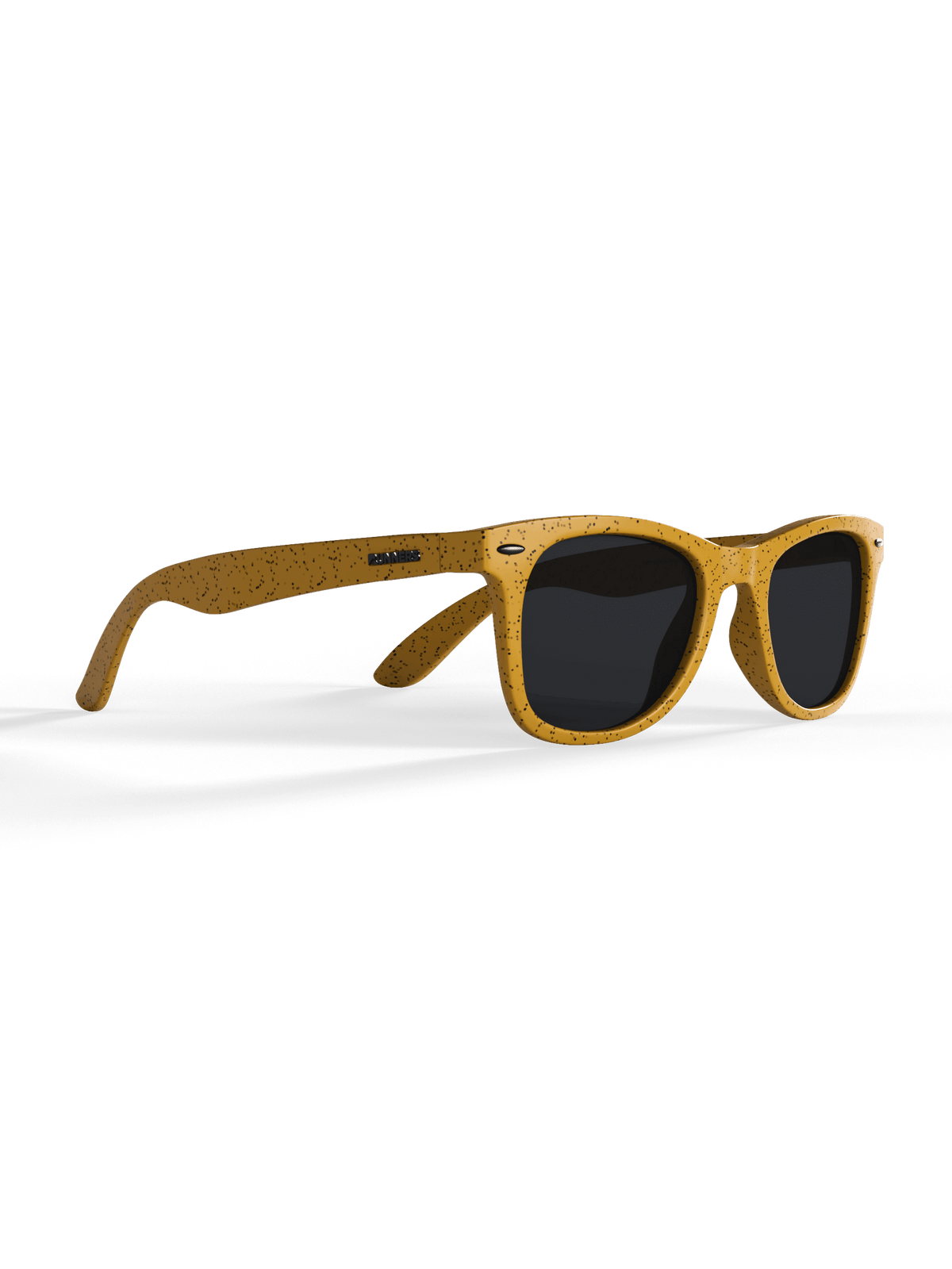 Yellow speckled sunglasses on black background.