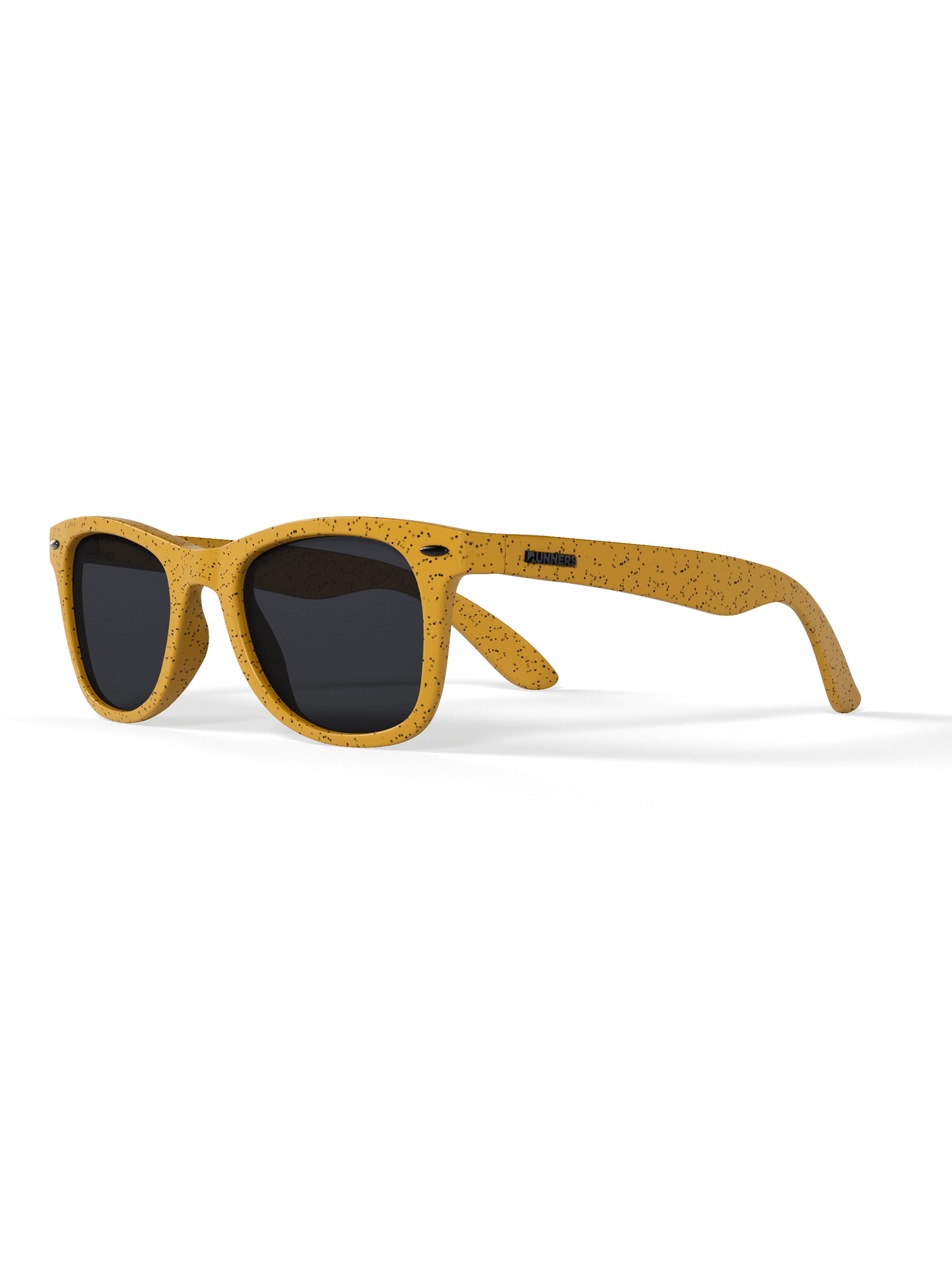Sunglasses with yellow frame and black lenses on a green background