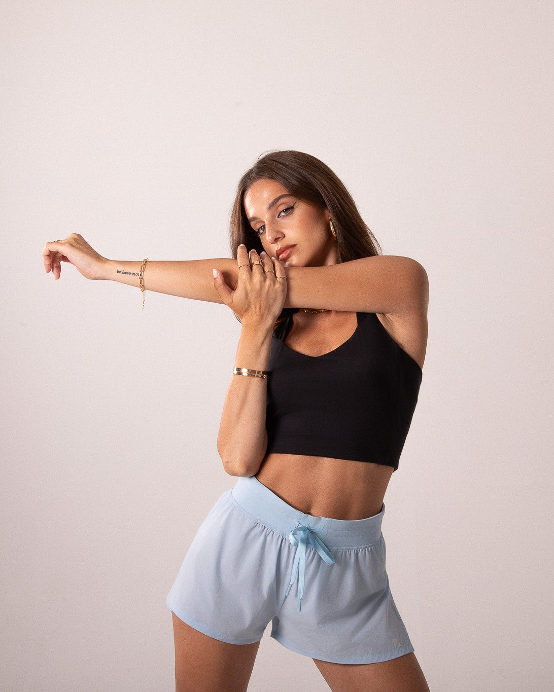 Runner's Athletics LuxeForm Functional Tank, model wearing black sports bra and shorts