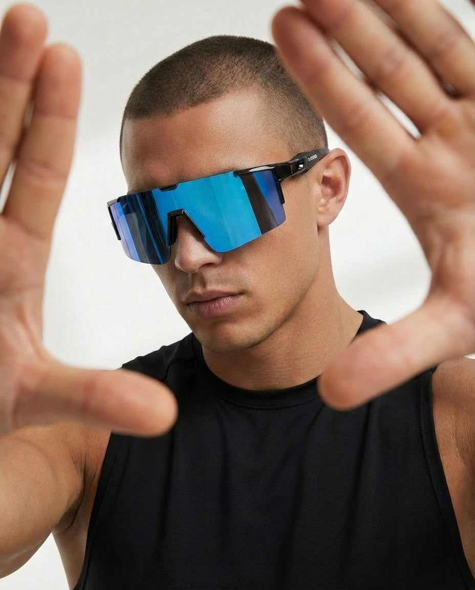Person wearing polarized x365 icy blue sunglasses with a white background
