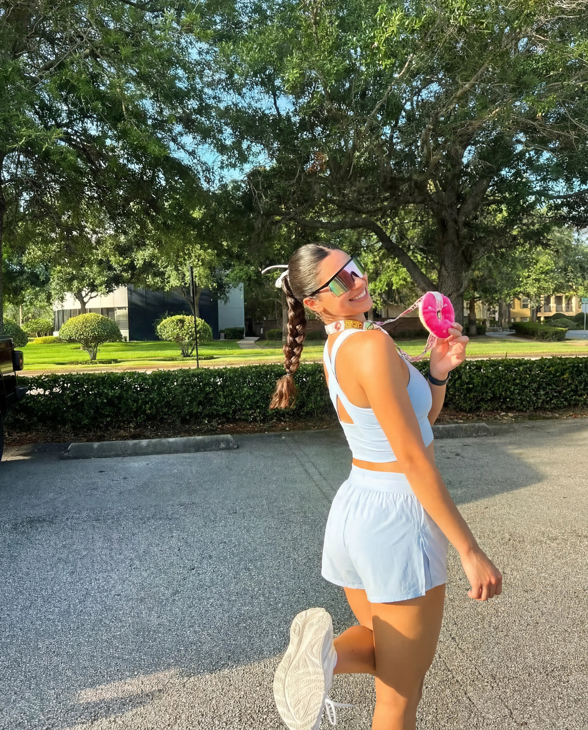 Baby blue workout set functional tank and flyaway shorts worn outdoors running