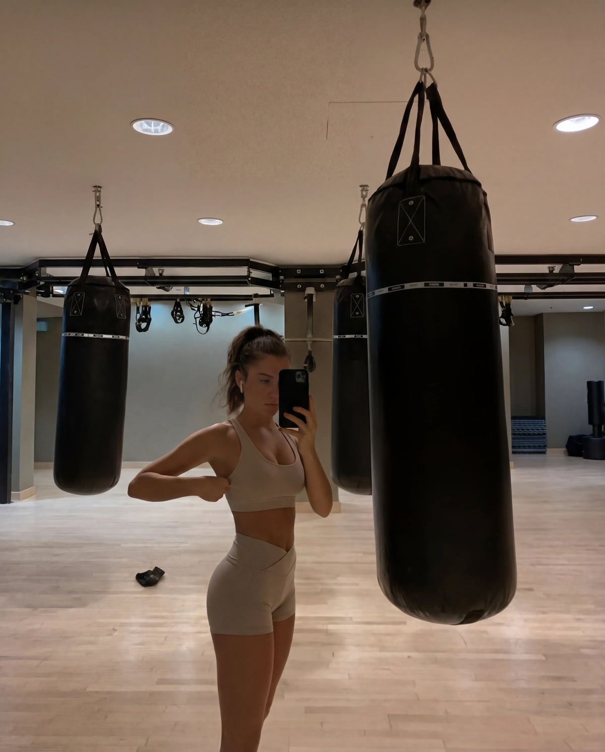 Taupe workout set strappy bra and mini sculpting shorts boxing gym mirror selfie